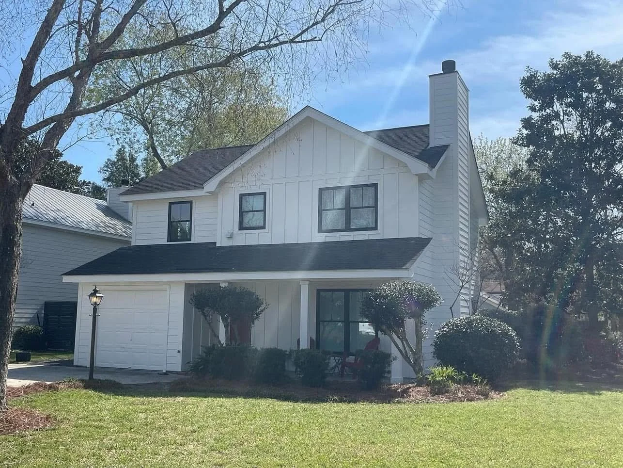 Old Village home after James Hardie siding and replacement-window installation